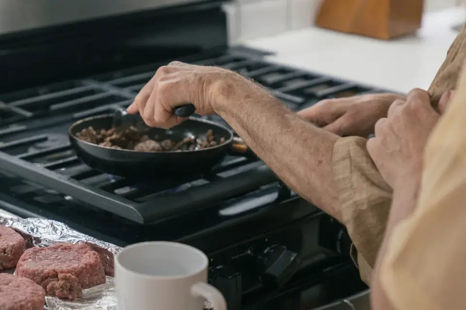 Dog owner preparing a meal