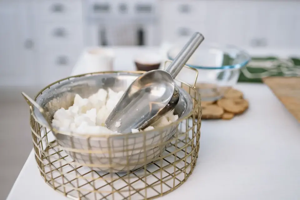 Soft chews for dogs laid out next to a dosing scoop on a kitchen counter