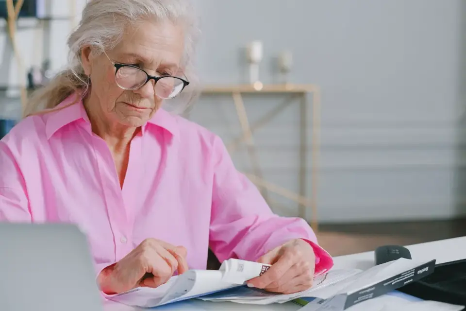 Veterinarian reading the ingredient panel on a pet supplement bottle